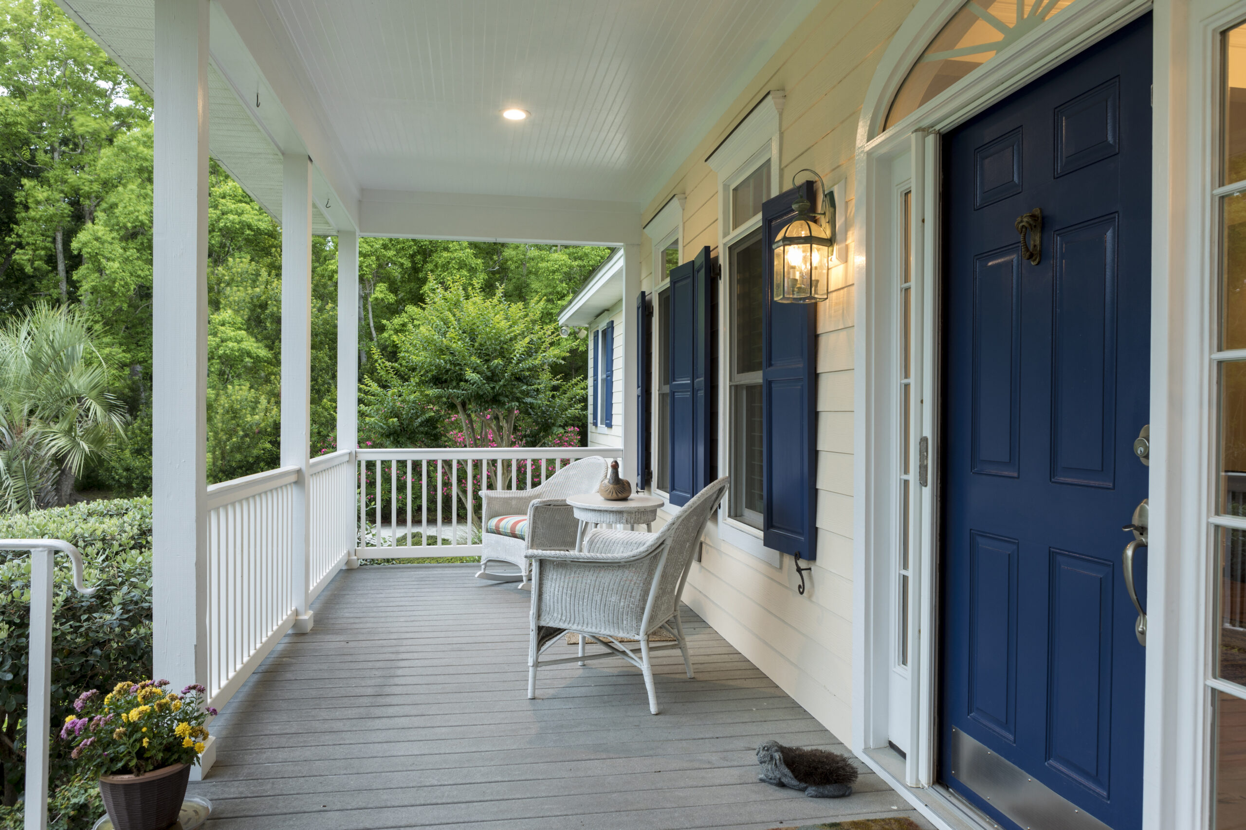 Beautiful front entrance of Southern home with covered porch.